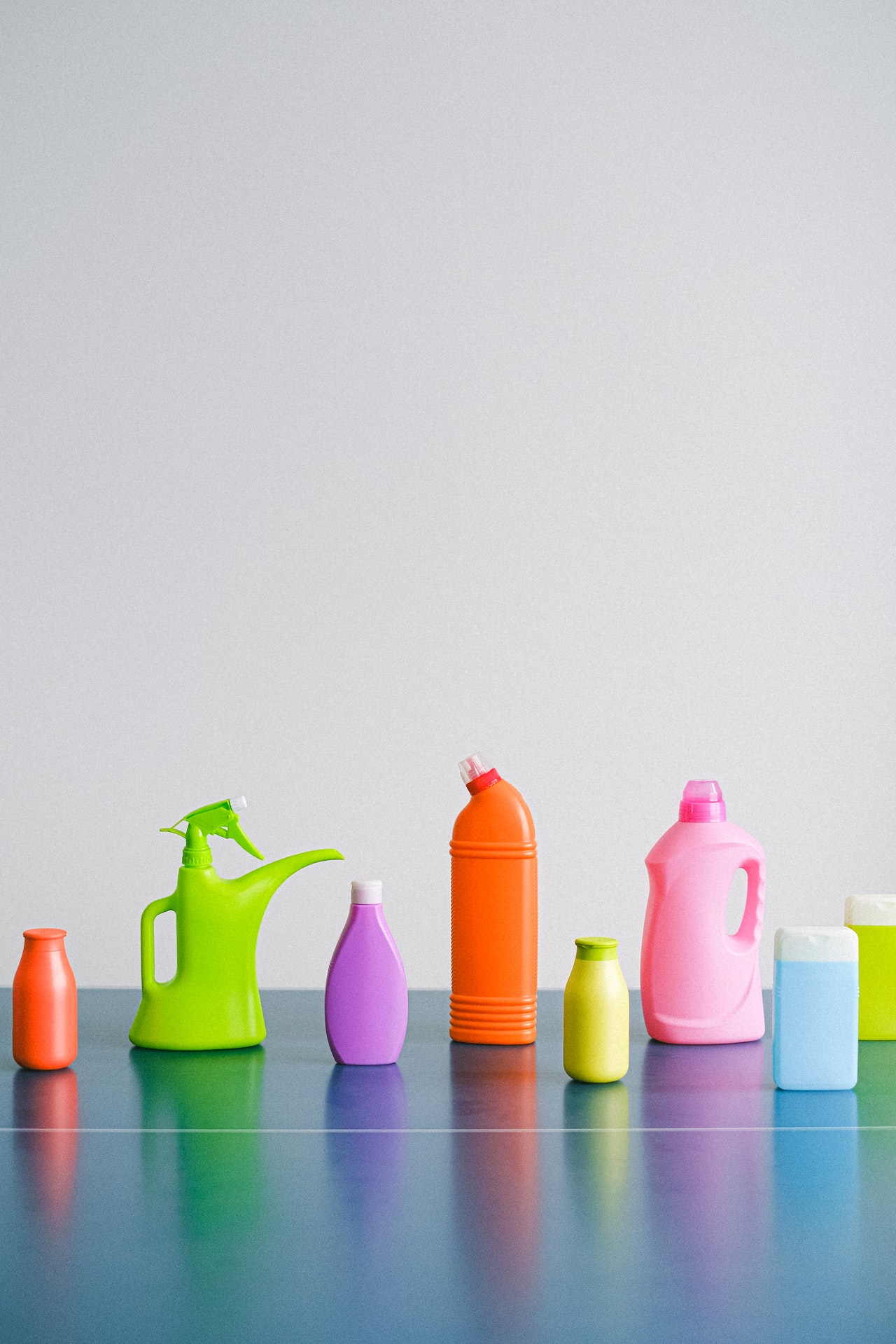 brightly colored laundry and cleaning product bottles to donate to food pantry