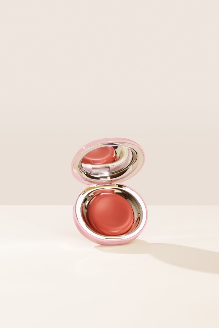 Rare Beauty apricot-colored melting blush in mirrored compact