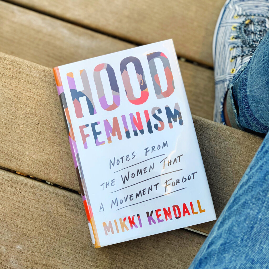 Cover of Hood Feminism book sitting on wooden steps