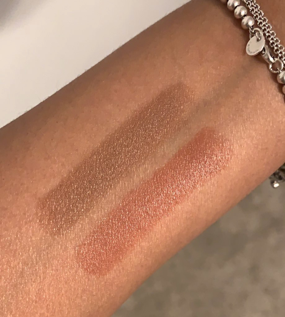 swatches of Mented Cosmetics Peach Please and Brand Nude lipsticks on brown skinned arm