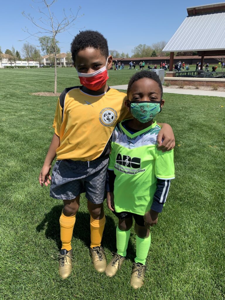 CLL boys in yellow soccer uniform (left) and green soccer uniform (right)